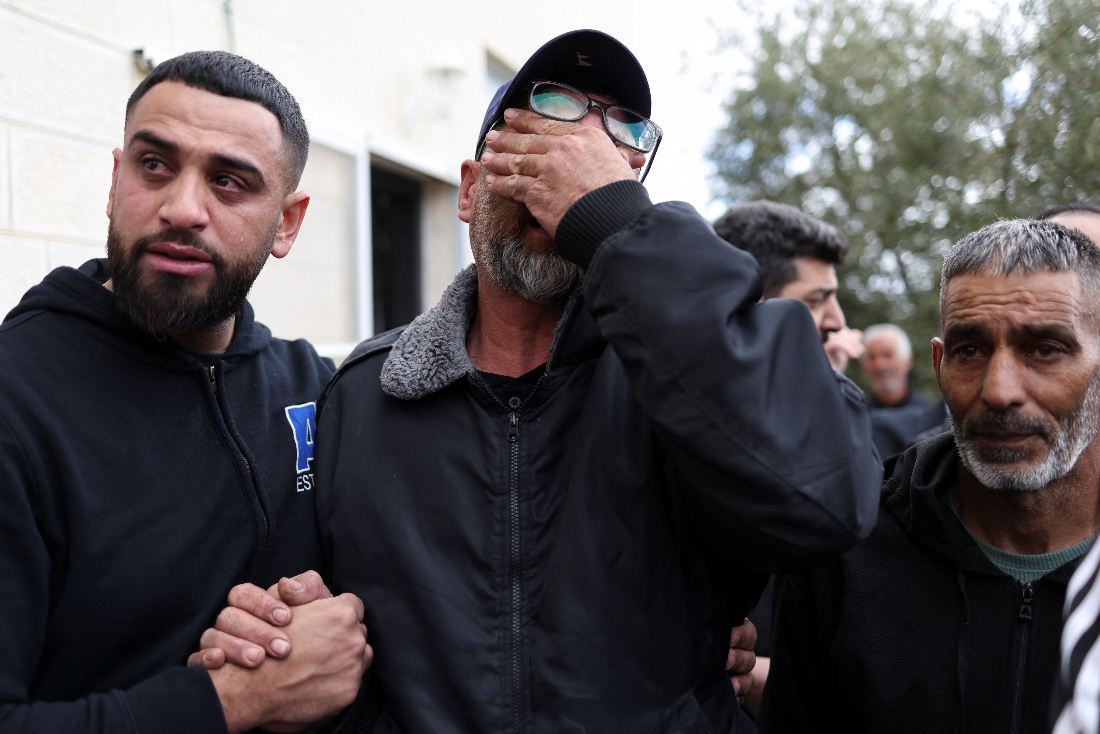 Mourners react during a funeral of Nasrallah Muhammad Jamal Abu Siam, 19, a Palestinian who, according to the Palestinian Ministry of Health, was killed by an Israeli settler, in the town of Mikhmas, near Ramallah in the Israeli-occupied West Bank. (Reuters)