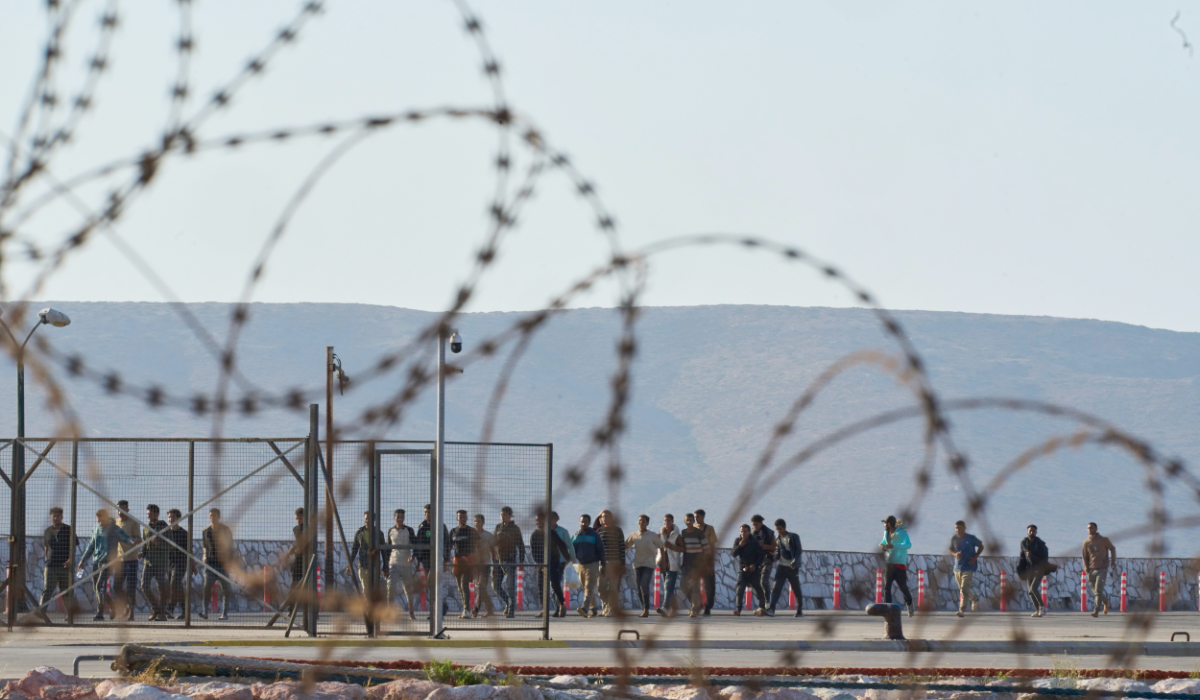 Migrants rescued south of Crete walk after their arrival at the the port of Lavrio, Greece, on Thursday, July 10, 2025. (AP)