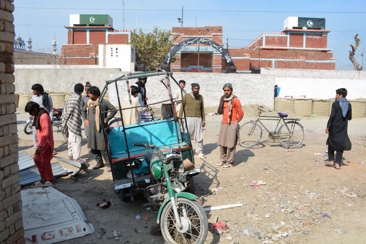 People gather at the site of an earlier bomb explosion in Bannu city of Pakistan’s Khyber Pakhtunkhwa province on Feb. 16, 2026. (AFP file photo)