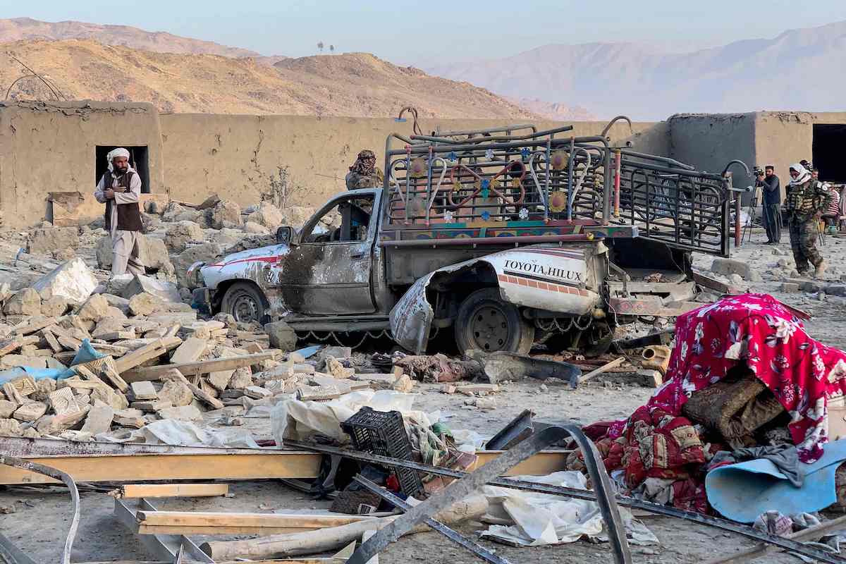 Afghan men search for victims after an overnight Pakistani airstrike hit a residential area in the Girdi Kas village of Bihsud district, Nangarhar province on Feb. 22, 2026. (AFP)