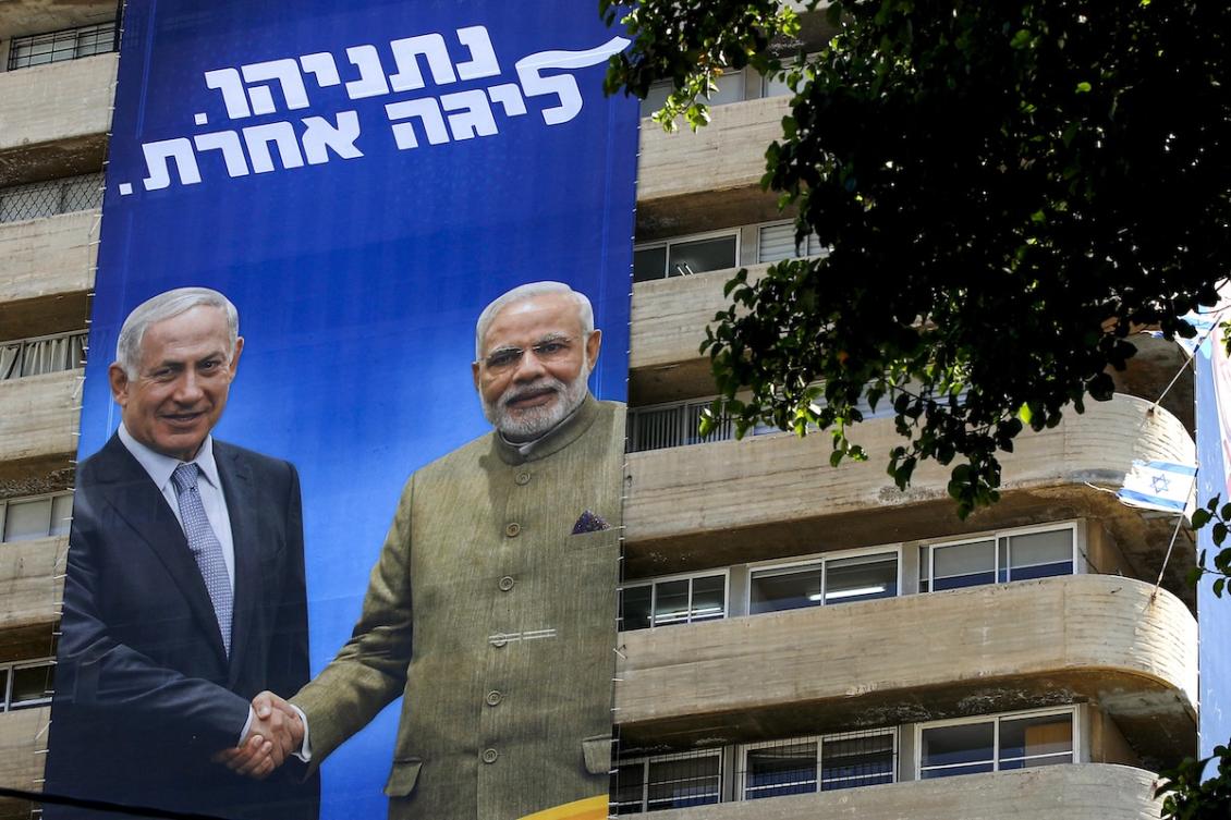 This picture taken on July 28, 2019 shows two giant Israeli Likud Party election banners hanging from a building showing Israeli Prime Minister Benjamin Netanyahu shaking hands with Indian Prime Minister Narendra Modi with a caption above reading in Hebrew "Netanyahu, in another league", in the coastal Mediterranean city of Tel Aviv. (FILE/AFP)
