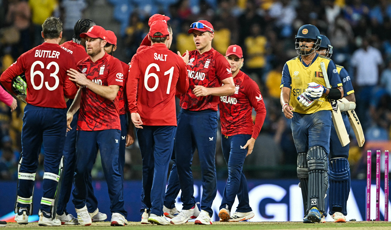 England's players celebrate their team's win against Sri Lanka at the end of their 2026 ICC Men's T20 Cricket World Cup Super Eights match in the Pallekele International Cricket Stadium, Kandy on February 22, 2026. (AFP)