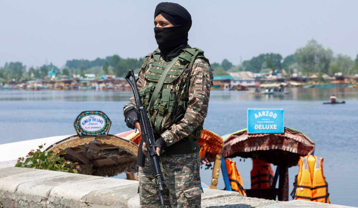 Indian security force personnel stands guard on the banks of Dal Lake, following a suspected militant attack near south Kashmir's Pahalgam, in Srinagar April 27, 2025. (REUTERS)