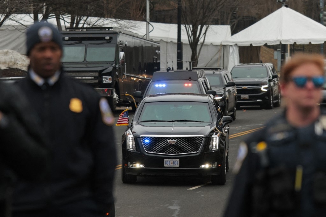 US Secret Service and Metropolitan Police stand between Anti-Trump and pro-Palestine protesters and the presidential motorcade outside the Donald J. Trump Institute of Peace in Washington, US. (AFP)