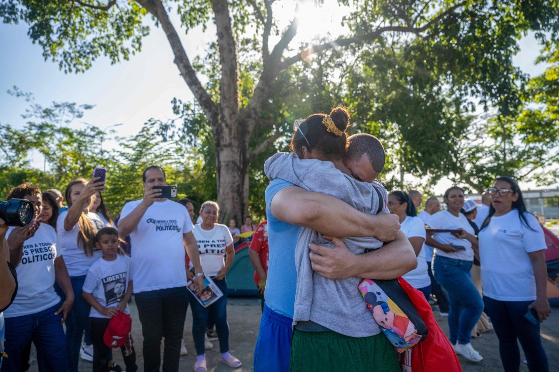 Venezuelan prisoner Jose Damasco greets his relatives after being released from El Rodeo I prison in Guatire, Venezuela. (AFP)