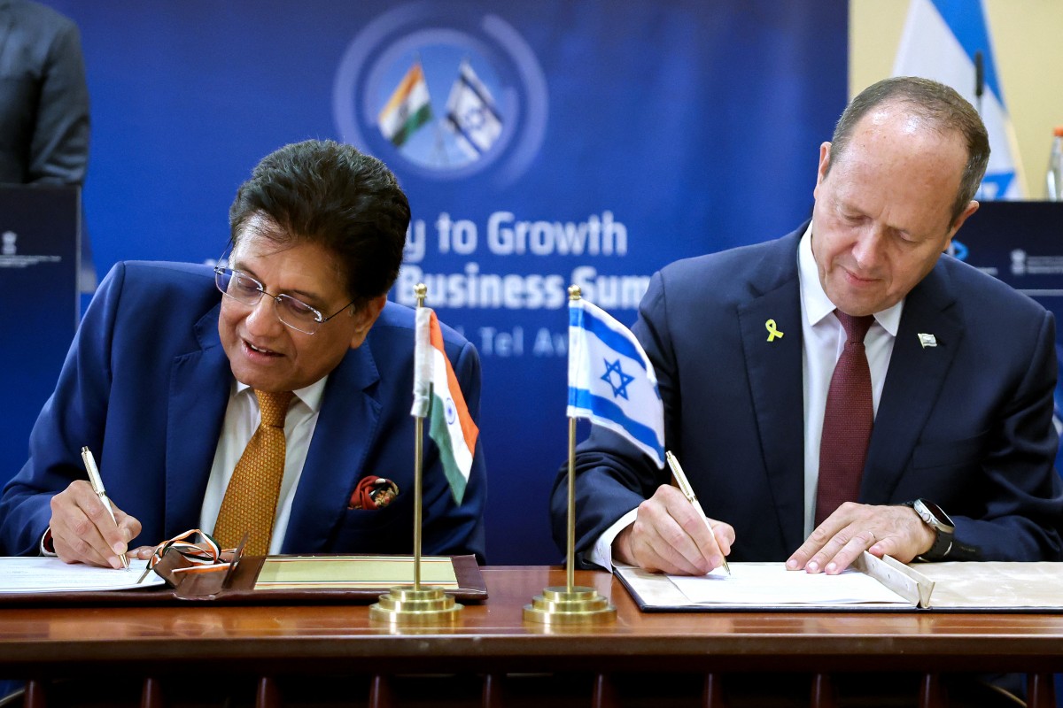India's Minister of Industry and Supply Piyush Goyal and Israeli Minister of Economy and Industry Nir Barkat sign agreements during the India-Israel Business Summit in Tel Aviv, Israel. (AFP)
