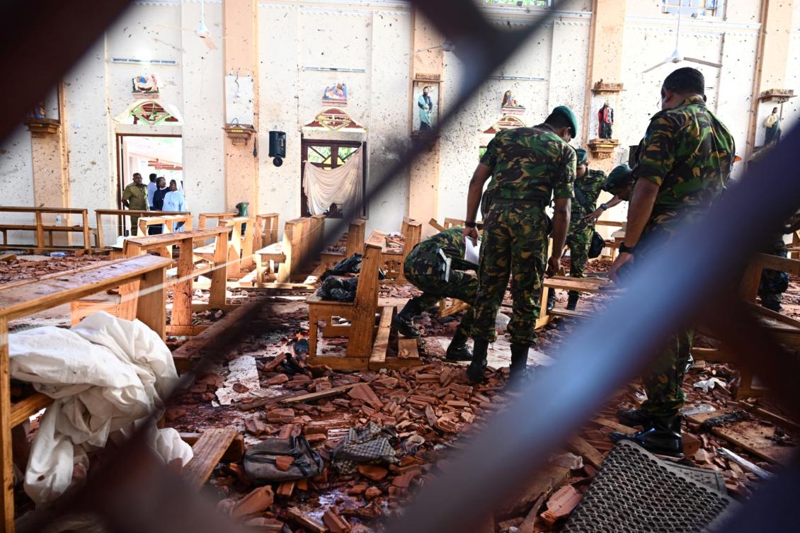 Security personnel inspect the interior of St Sebastian’s Church in Negombo on April 22, 2019, a day after the church was hit in series of bomb blasts. (AFP file photo)