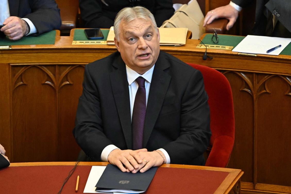 Hungarian Prime Minister Viktor Orban reacts prior to delivering a speech before the agenda during the spring session of the Hungarian Parliament in Budapest, Hungary, on February 23, 2026. (Photo by Attila KISBENEDEK / AFP)