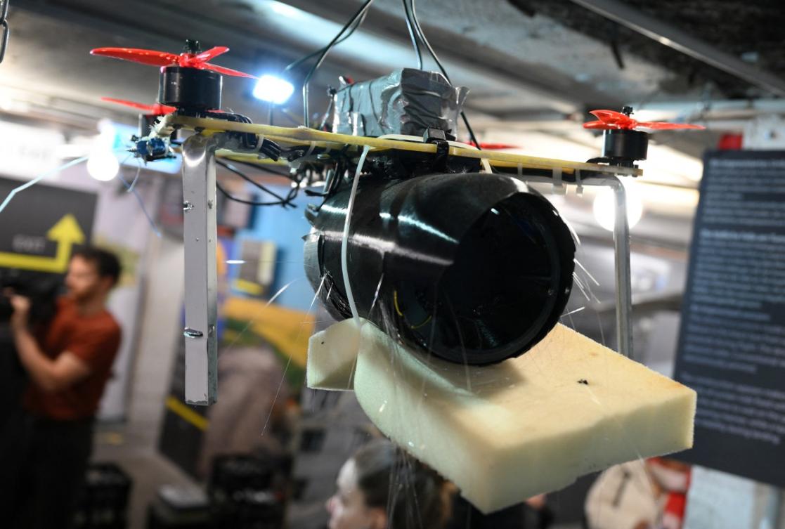 A Russian FPV combat drone with red propellers is on display during a press presentation of the "Ukraine Museum" in the "Berlin Story Bunker" on February 23, 2026 in Berlin, one day before the exhibition's opening to the public and the fourth anniversary of Russia's invasion in Ukraine. (AFP)