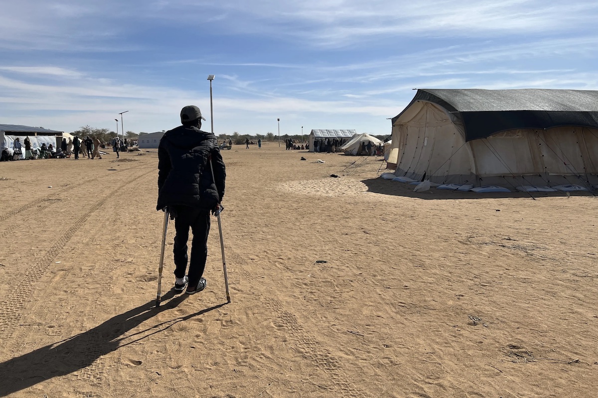 A 22-year-old man shot in the foot by the RSF but survived mass killings in El-Fasher, is a refugee in eastern Chad. HRW says the RSF targeted people with disabilities during the attack. (Human Rights Watch)