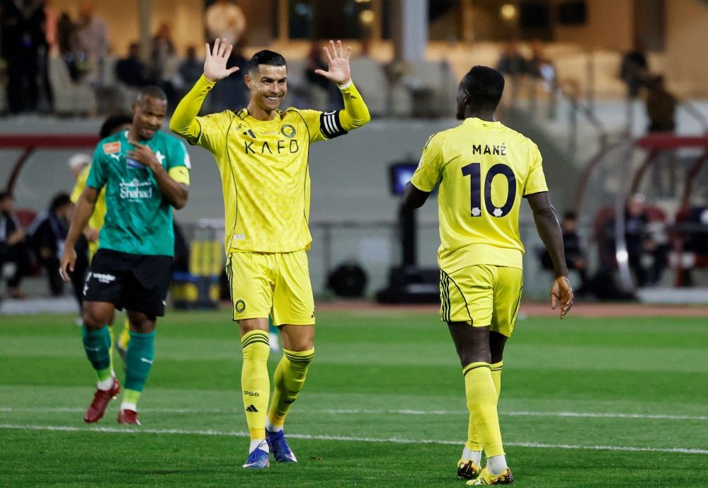 Sadio Mane celebrates scoring Al-Nassr’s fourth goal with Cristiano Ronaldo at Abdullah Sport City Stadium, Jeddah, Saudi Arabia, Feb. 25, 2026. (Reuters)