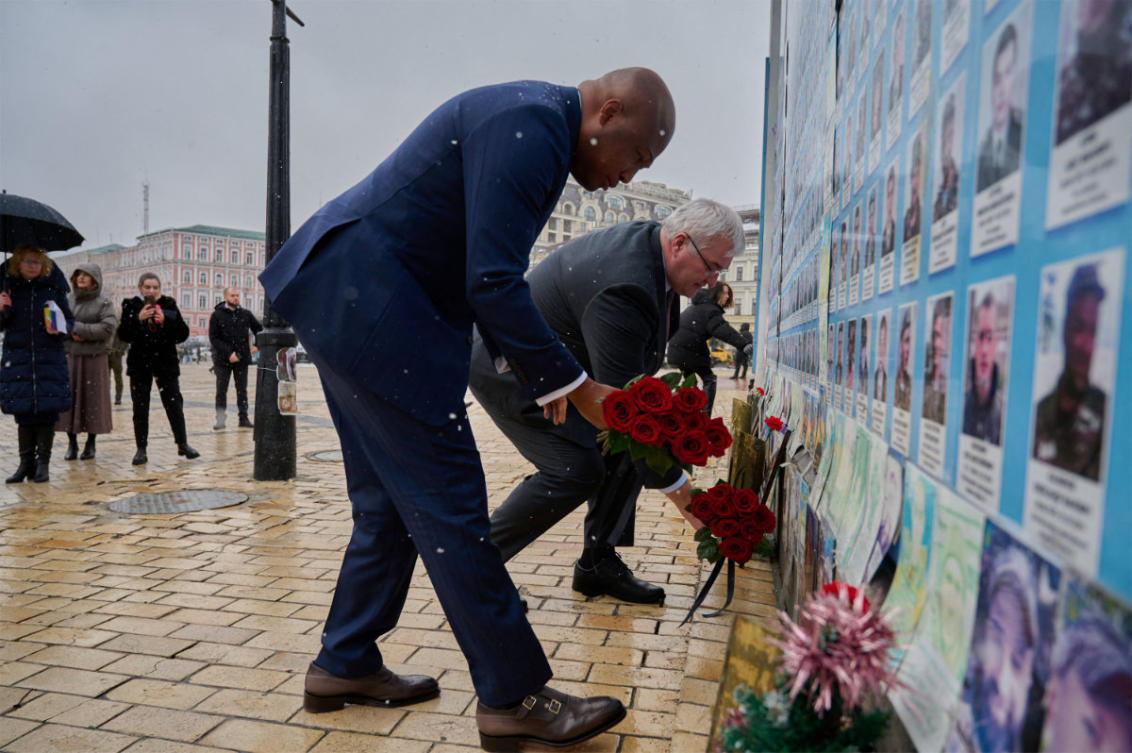 Ukrainian Foreign Minister Andrii Sybiha and his Ghanaian counterpart Samuel Okudzeto Ablakwa visit the Wall of Remembrance of the Fallen for Ukraine outside the Saint Michael's Cathedral, amid Russia's attack on Ukraine, in Kyiv, Ukraine February 25, 2026. (Handout via REUTERS)