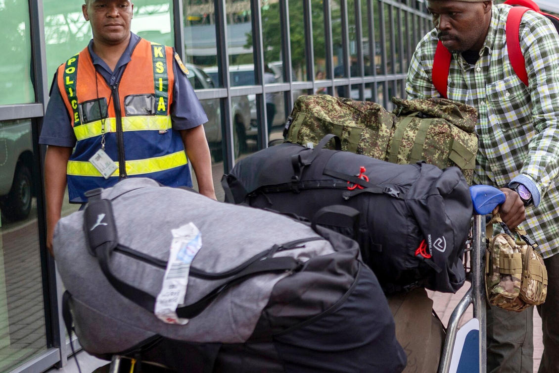 South African men who were allegedly tricked into fighting for Russia in the war in Ukraine arrive at King Shaka International Airport in Durban, Feb. 25, 2026. (AP)