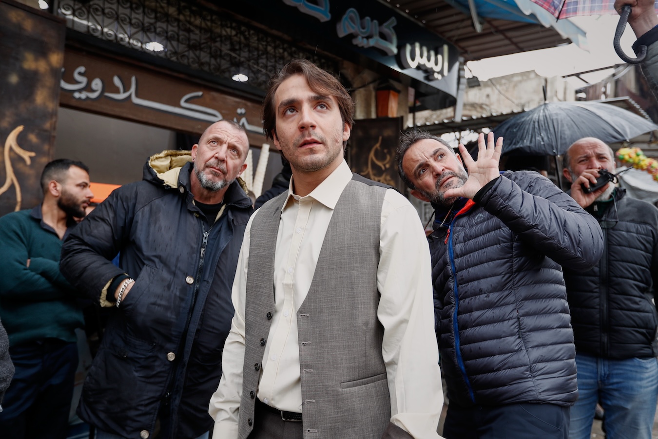 Director Allaith Hajjo (center, right) gives instructions to actor Wissam Rida (center) while filming 'Al-Souriyoun Al-Aada.' (AP Photo)