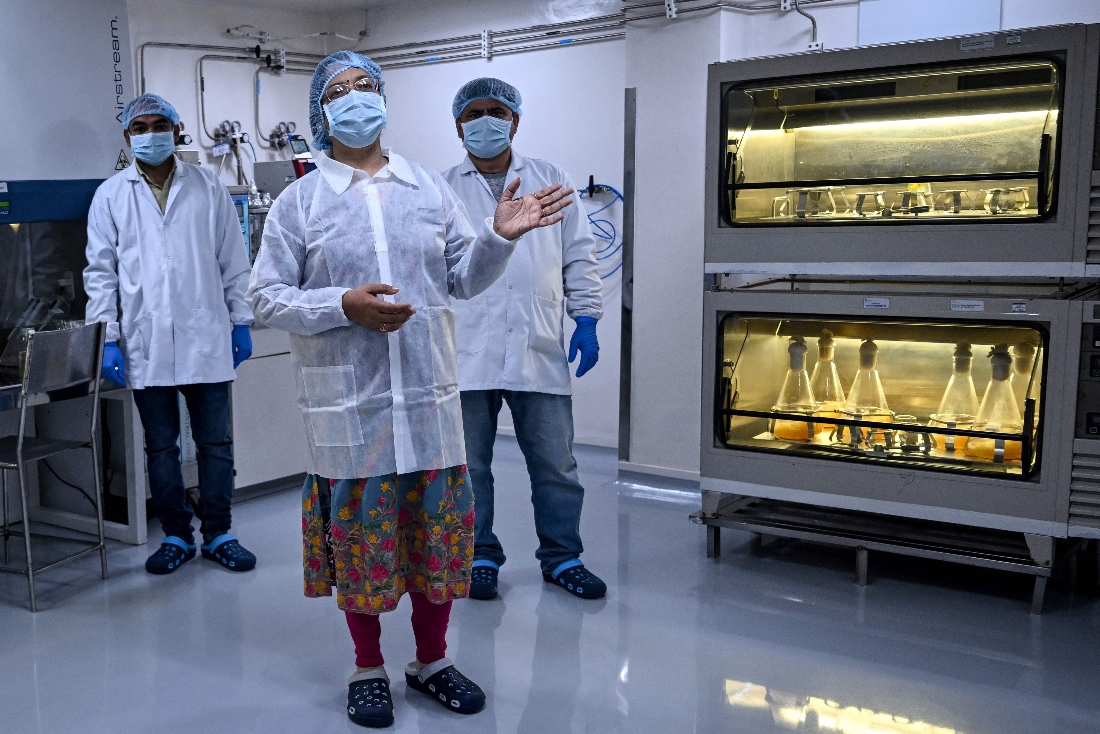 Head of biological R&D Priyanka Priyadarsiny explaining the process of vaccine development in the laboratory of Panacea Biotec, in New Delhi, India. (AFP)