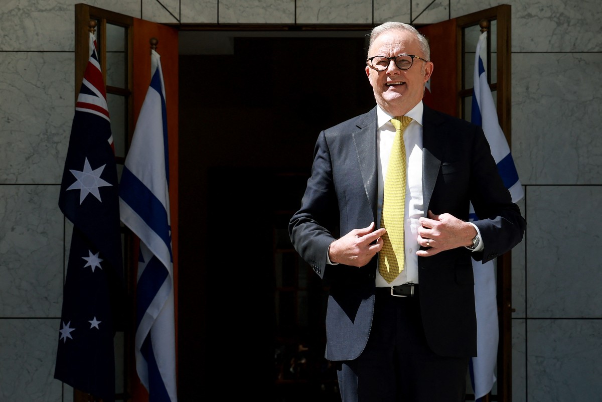 Australia's Prime Minister Anthony Albanese waits to receive Israel's President Isaac Herzog at the Parliament House in Canberra, Australia. (AFP)