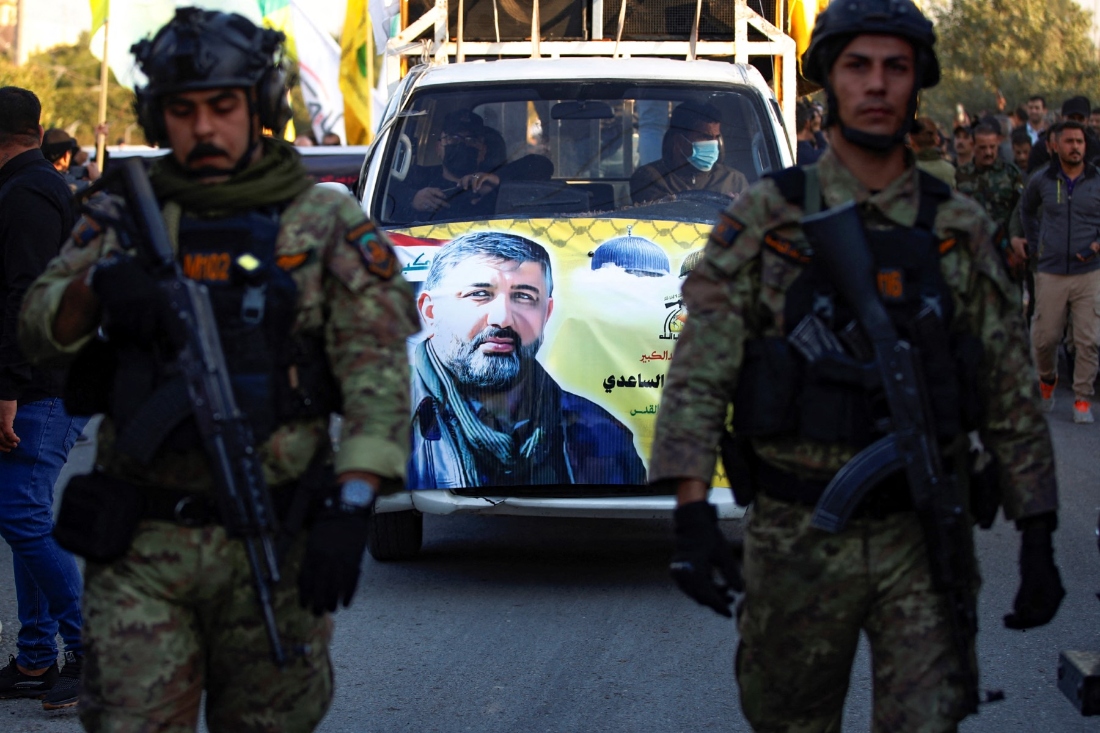 A portrait of Abu Baqr al-Saadi, a prominent leader in the Kataeb Hezbollah, who was killed in a strike carried out a day earlier by an American drone that targeted his car in a vital neighbourhood in Baghdad. (AFP)