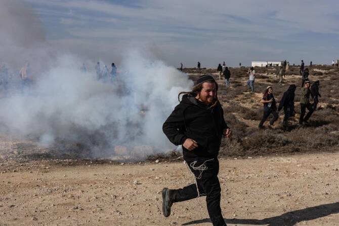 Two Israeli NGOs denounced an attack Friday in which settlers used sticks to beat two activists in the occupied West Bank, calling the incident “state violence” and “Jewish terrorism.” (AFP/File)