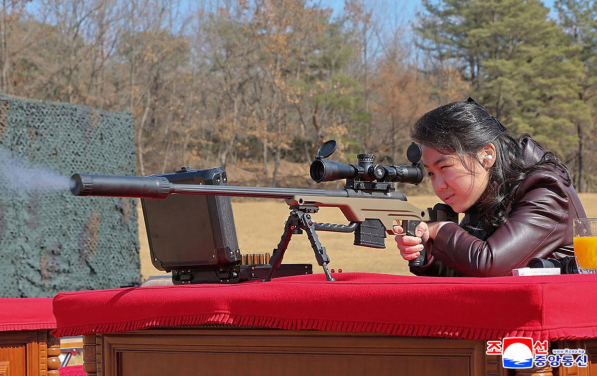 This picture taken on February 27, 2026 shows North Korean leader Kim Jong Un's daughter Kim Ju Ae firing a new sniper rifle, at an undisclosed place in North Korea. (Photo by KCNA VIA KNS / AFP)