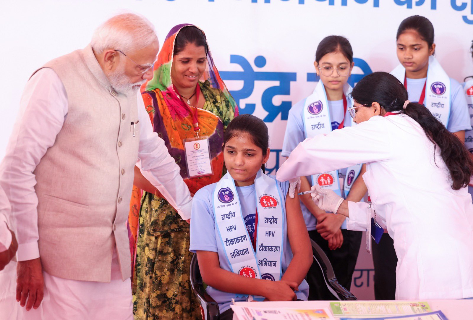 A young girl takes a shot of HPV vaccine in the presence of Prime Minister Narendra Modi in Ajmer, Rajasthan on Feb. 28, 2026. (Indian Ministry of Health)