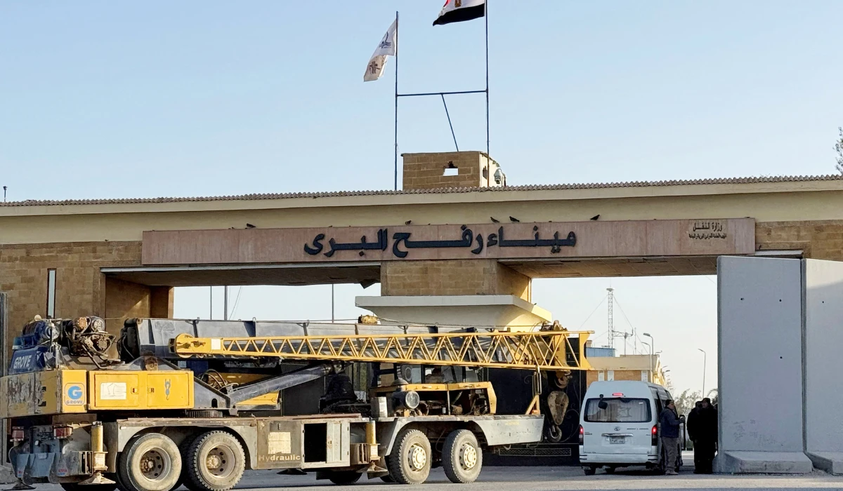 A construction crane enters through the Egyptian side of the Rafah border crossing with the Gaza Strip in northeastern Egypt on February 1, 2026. (AFP)