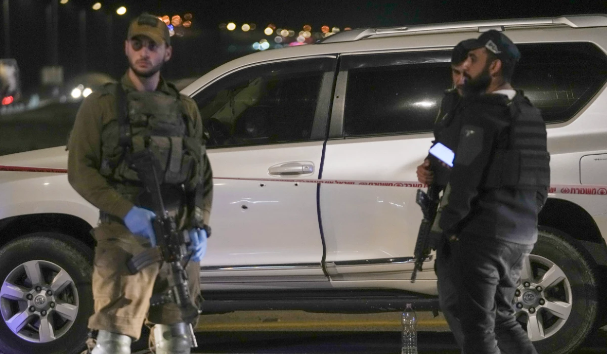 Israeli security forces examine the scene of a shooting attack near the West Bank city of Jericho, Monday, Feb. 27, 2023. (AP)