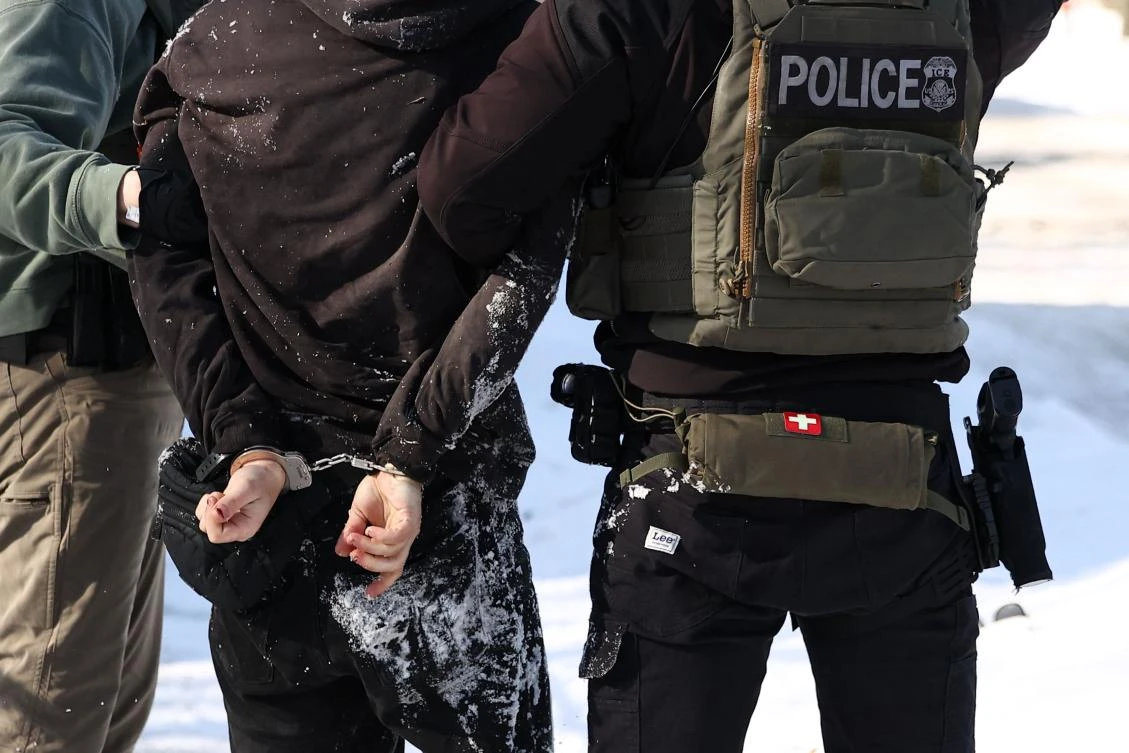 Federal agents detain a protester in Minneapolis, Minnesota on February 3, 2026. (AFP)
