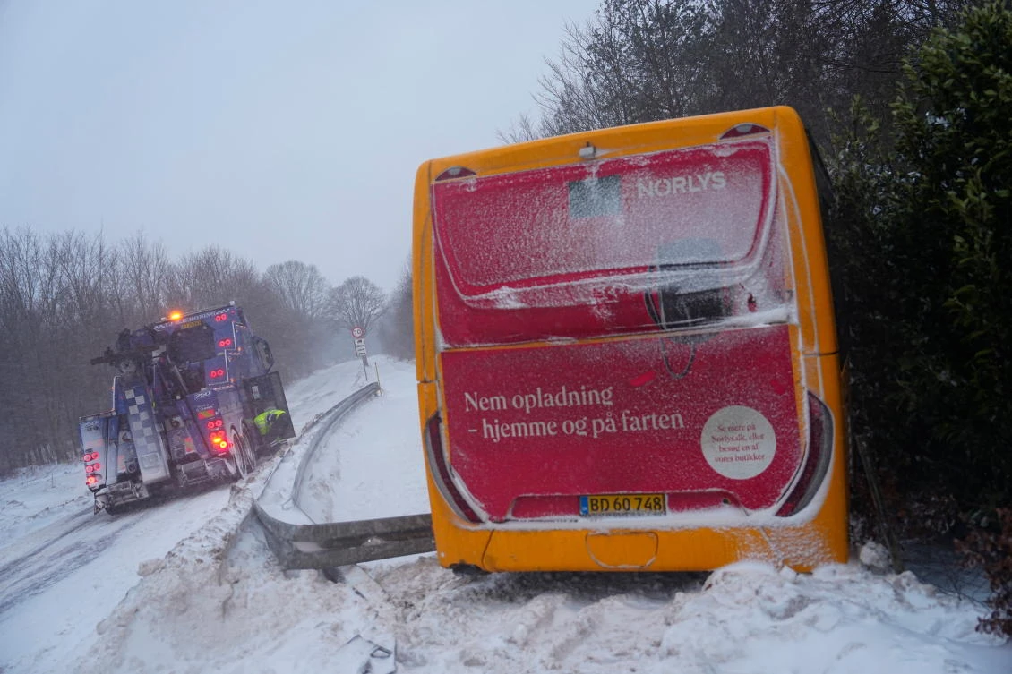 A bus is stranded after sliding off the road in the slippery conditions near Sigerslev on Stevns, Denmark on Feb. 5, 2026. (Ritzau Scanpix via AP)