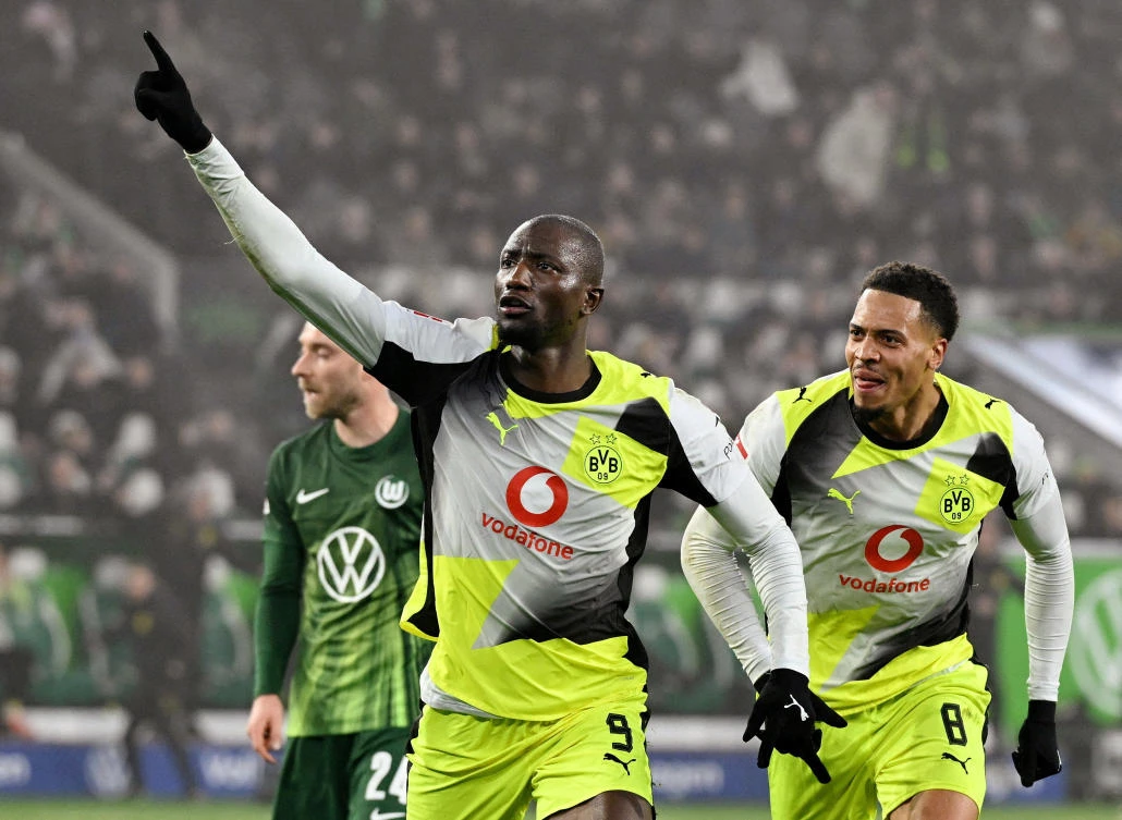 Borussia Dortmund’s Serhou Guirassy celebrates scoring their second goal with Felix Nmecha during their match against VfL Wolfsburg — Volkswagen Arena, Wolfsburg, Germany — Feb. 7, 2026. (Reuters)