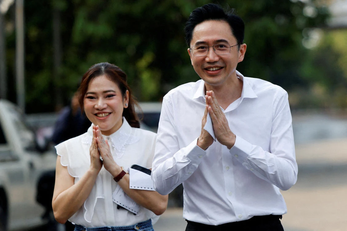 Yodchanan Wongsawat, Pheu Thai Party prime ministerial candidate, and his wife Nantakan Silsaveekul greet people on the day of the general election at a polling station in Bangkok, Thailand, February 8, 2026. (Reuters)