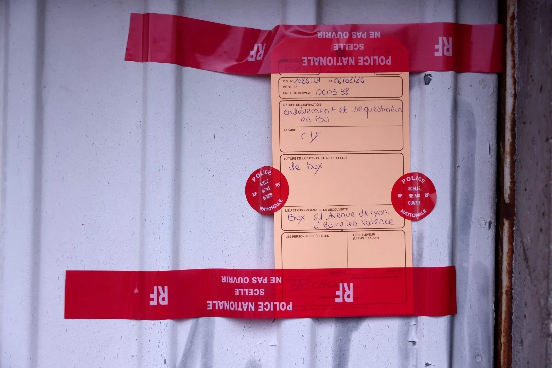 This photograph shows police seals on a garage door where two women were found injured in Bourg-les-Valence, in the Drome department, southeastern France. (AFP)