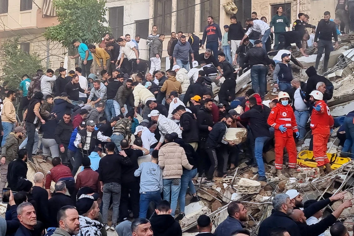 Rescue teams search for survivors in building collapse that killed at least 9 in northern Lebanon