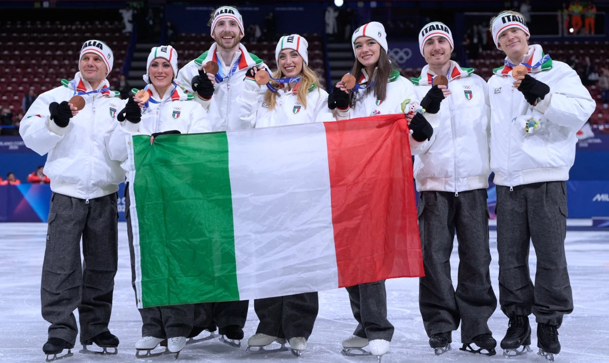 Team Italy celebrate after winning the bronze medal for the figure skating team event at the 2026 Winter Olympics, in Milan, Italy, Sunday, Feb. 8, 2026. (AP)