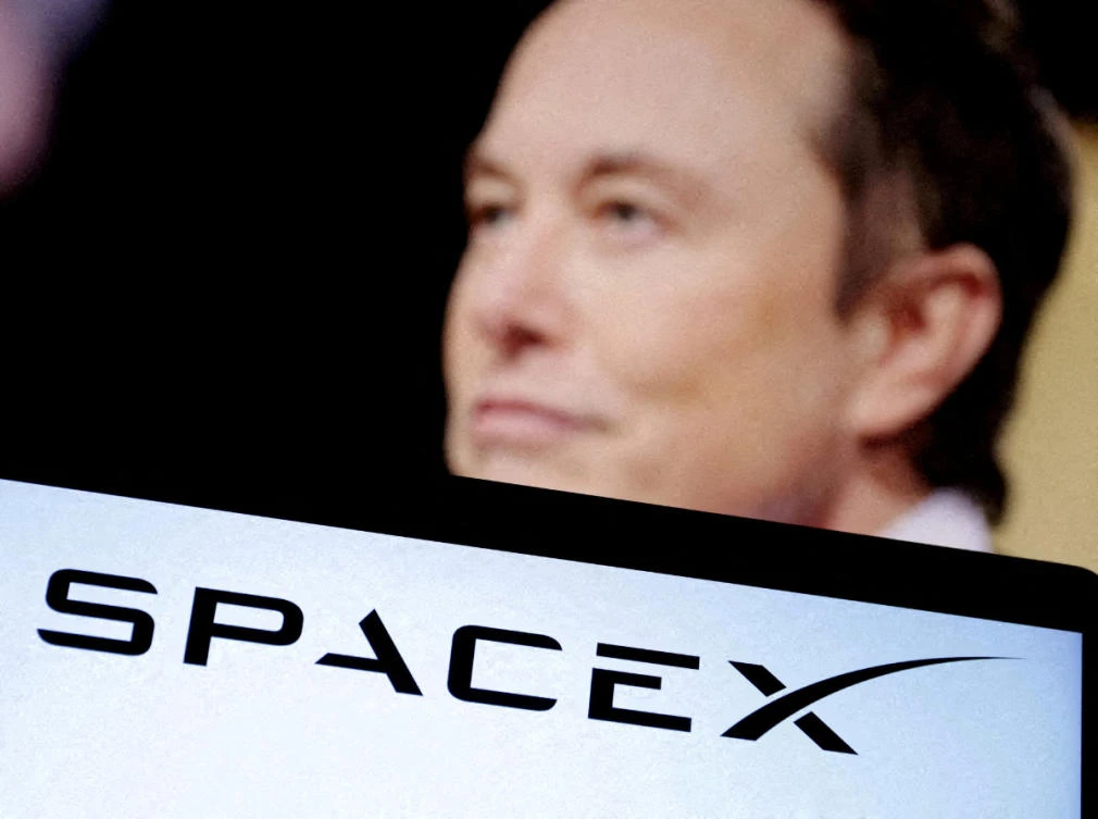 SpaceX's logo and an Elon Musk photo are seen in this illustration created on December 19, 2022. (REUTERS/File)
