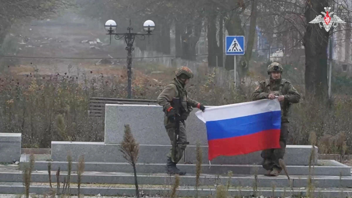 FILE PHOTO: Soldiers hold a Russian flag in Pokrovsk, Donetsk Region, Ukraine, in this screengrab from video released December 1, 2025.(Reuters)
