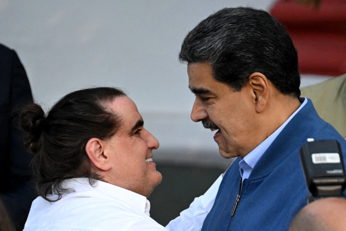 Venezuela’s President Nicolas Maduro welcomes Colombian businessman Alex Saab at the Miraflores Presidential Palace in Caracas on December 20, 2023. (AFP/File)