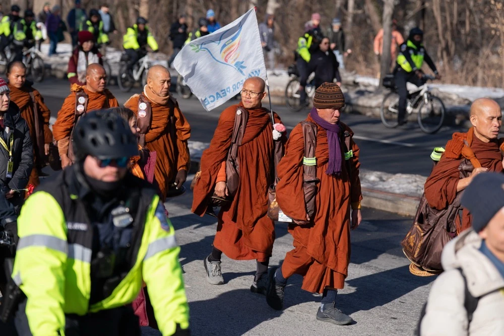 Buddhist monks who are participating in a Walk For Peace walk through a the streets of Washington. (AP)