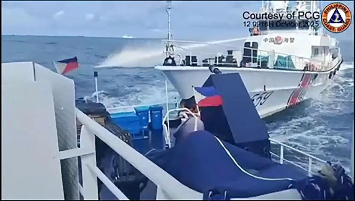 The Philippines and China have been locked in a series of maritime confrontations in recent years. Above, a China Coast Guard ship deploys water cannon against its Philippine counterpart in this video grab on Oct. 12, 2025. (Philippine Coast Guard/AFP)
