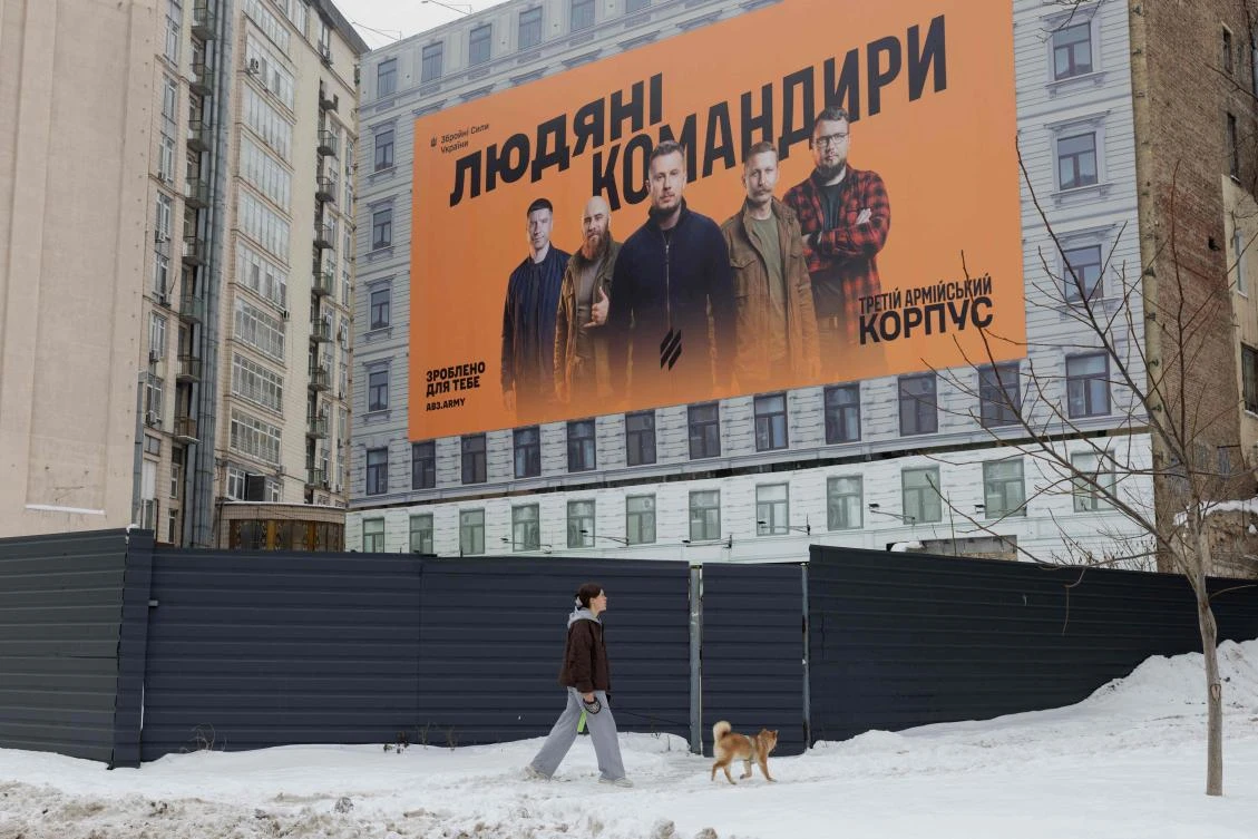 Above, a Ukrainian Army recruiting billboard in Kyiv. Britain on Thursday pledged hundreds of millions of dollars in air defenses for Ukraine. (AFP)