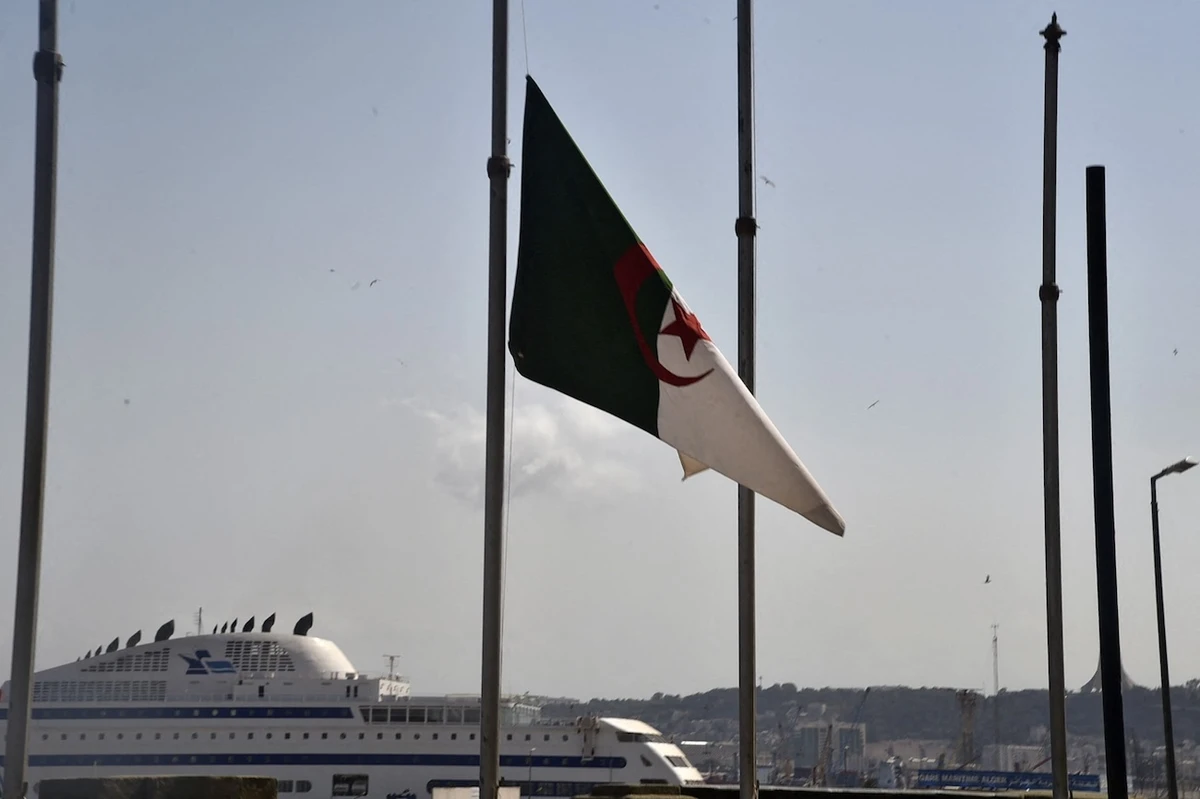 The Algerian national flag flies in the capital Algiers. (File/AFP)