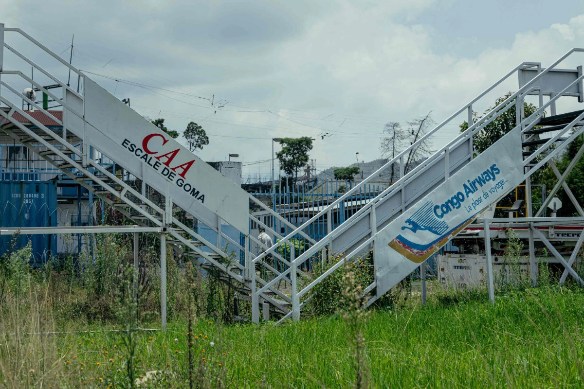 A general view of the Goma International Airport in DR Congo, showing visible signs of fighting, with abandoned and damaged helicopters, destroyed warehouses and vegetation gradually overtaking the facilities after nearly a year of inactivity. (AFP)