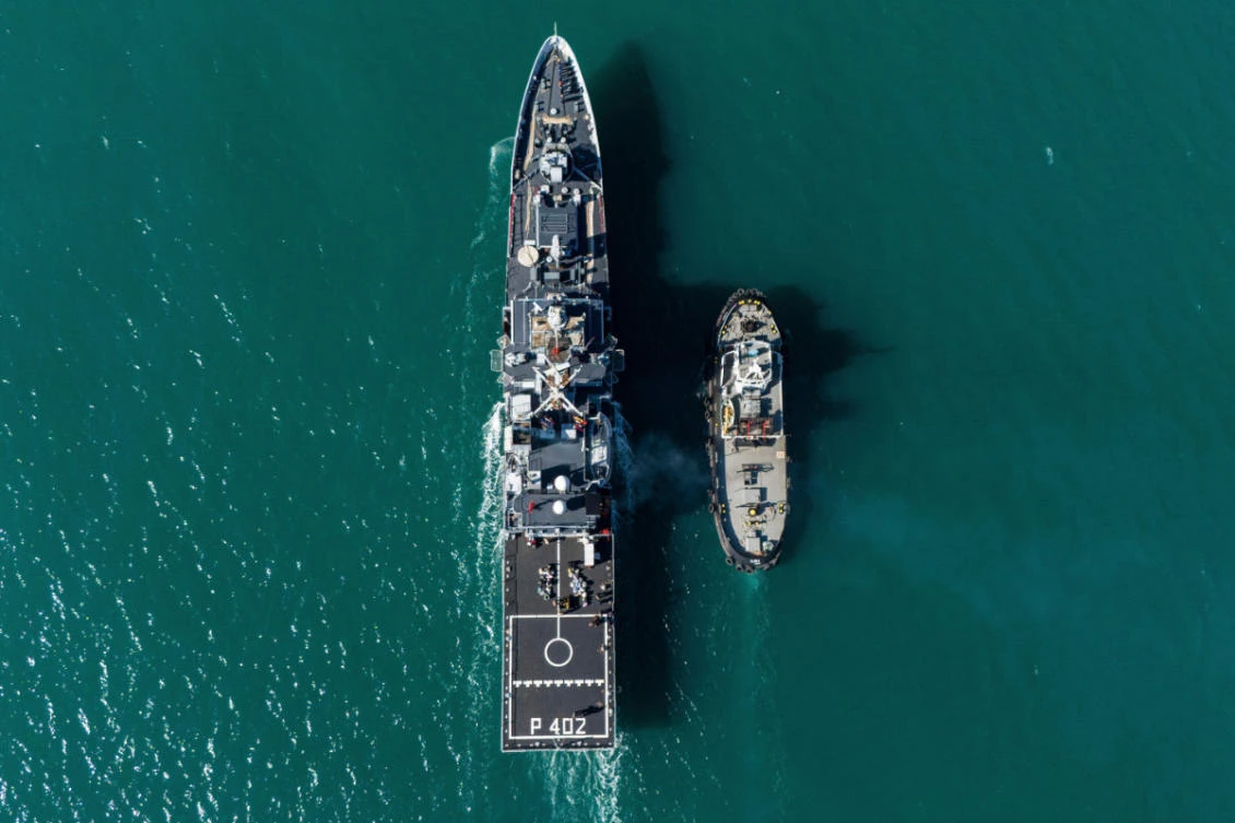The Italian navy ship Libra, carrying migrants, arrives in Shengjin, Albania, in April 2025. Italy is tightening rules to stem the flow of migrants. (AP/File)