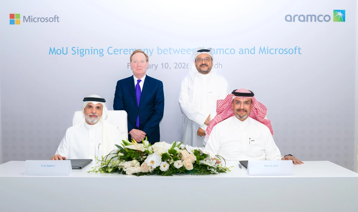 Aramco senior vice president of digital & information technology Sami A. Al Ajmi (right) and Microsoft Arabia president Turki Badhris (left) sign the agreement, as Aramco executive vice president of Technology & Innovation Ahmad O. Al Khowaiter (standing right) and Microsoft vice chair and president Brad Smith (standing left) look on. Supplied