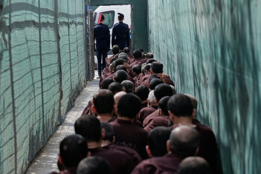 Iraqi security forces lead Daesh militants for questioning, after they were transferred from Syria to Iraq, at Al-Karkh Central Prison in Baghdad, Iraq. (AP)