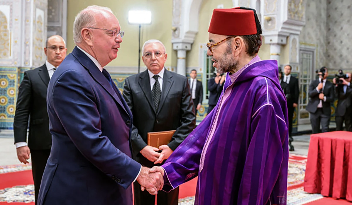 Morocco's King Mohammed VI (R) shakes hands with the Chairman of Safran Ross McInnes, at the Royal Palace in Casablanca on February 13, 2026. (AFP)