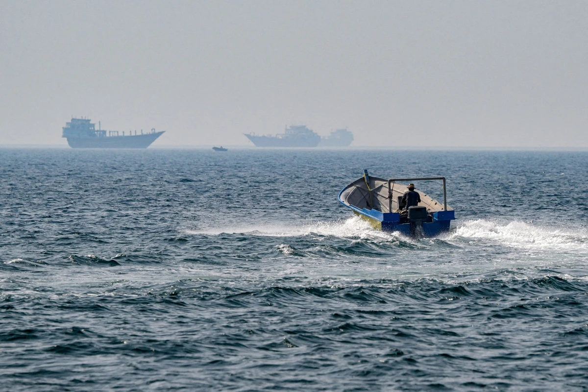 A boat sails in the waters of the Strait of Hormuz off Khasab in Oman’s northern Musandam peninsula on June 25, 2025. (AFP)