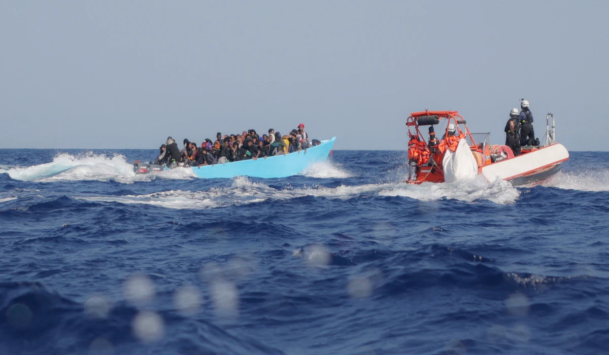 Migrants aboard an overcrowded boat are approached by the crew of the migrant search and rescue ship Sea-Watch 5, operated by the German NGO Sea-Watch, during a rescue operation in the Search and Rescue (SAR) zone in the central Mediterranean, off Libya, August 11, 2025. (REUTERS)