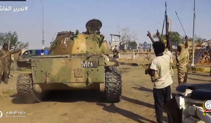 RSF fighters celebrating in the streets of El-Fasher in Sudan's Darfur. (AFP/File)