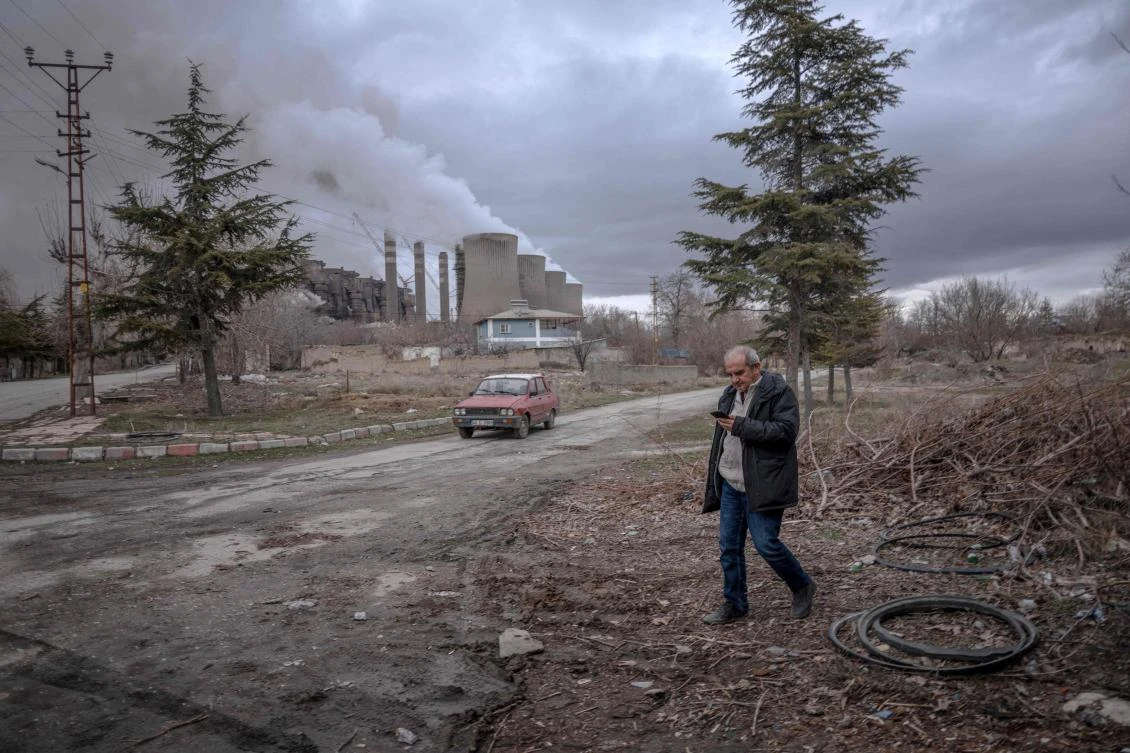 Kaddafi Polat rarely mentions his own health after decades of breathing the polluted air blanketing his village beneath the towering chimneys of a coal?fired power plant in southern Turkiye. (AFP)