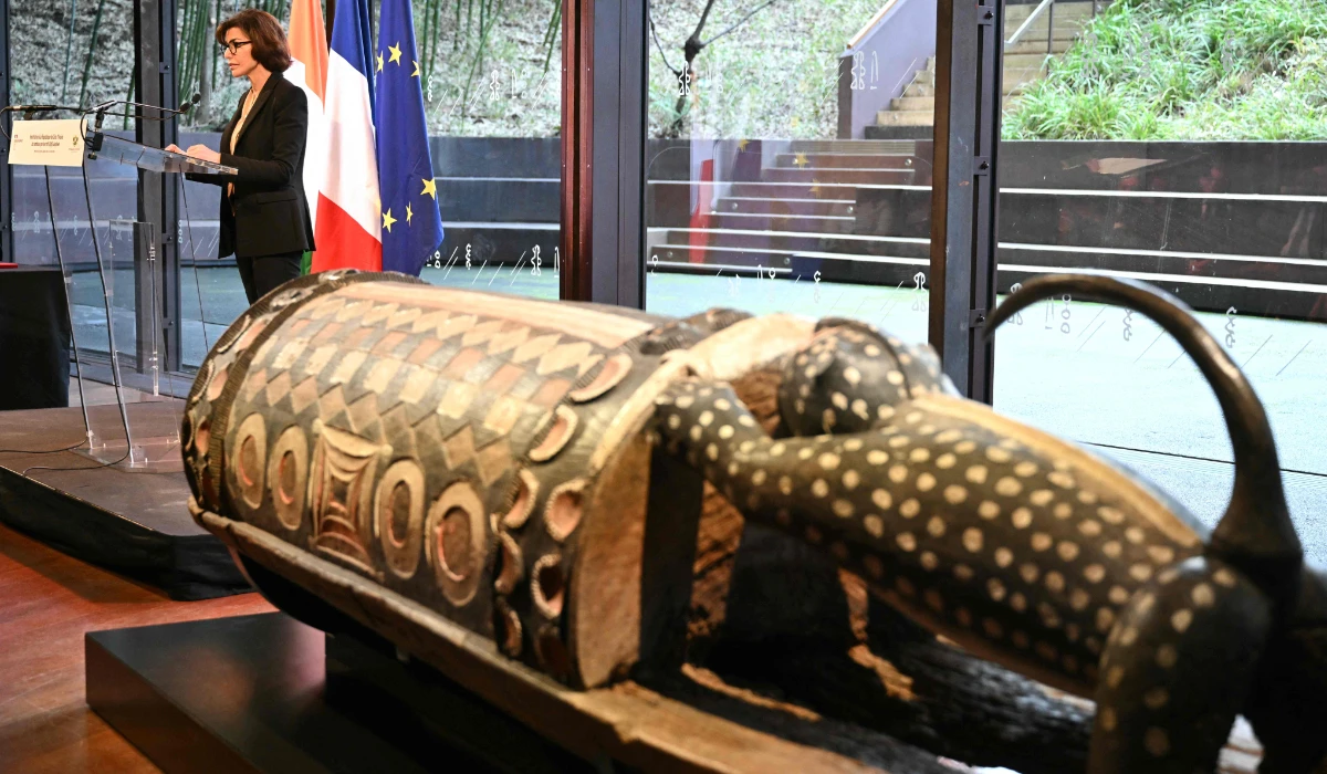 France's Culture Minister Rachida Dati addresses the audience during a ceremony for the official restitution to the Republic of Cote d'Ivoire of the sacred talking drum Djidji Ayokwe, confiscated in 1916 by French colonial authorities from the Ebrie people, at the Musee du Quai Branly in Paris on February 20, 2026. (AFP)